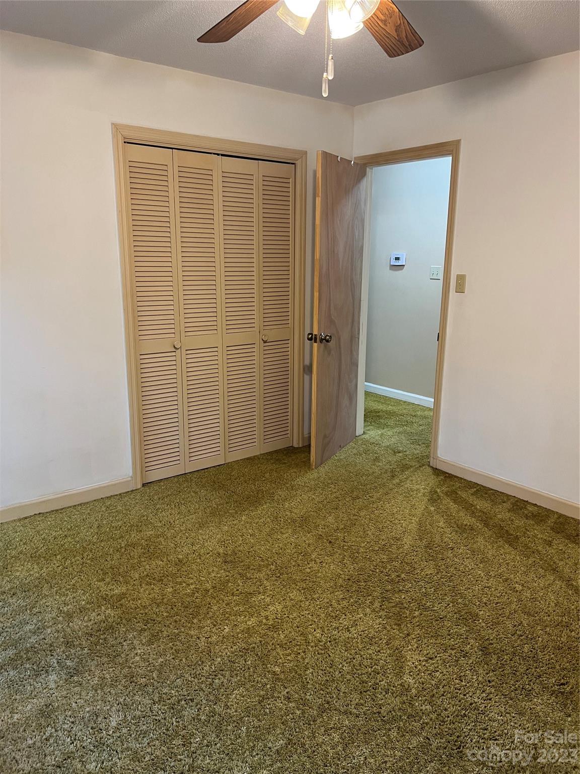 1765 Carnes Wilson Road Lancaster, SC 29720 - Photo 20 of 40 an empty room with a ceiling fan