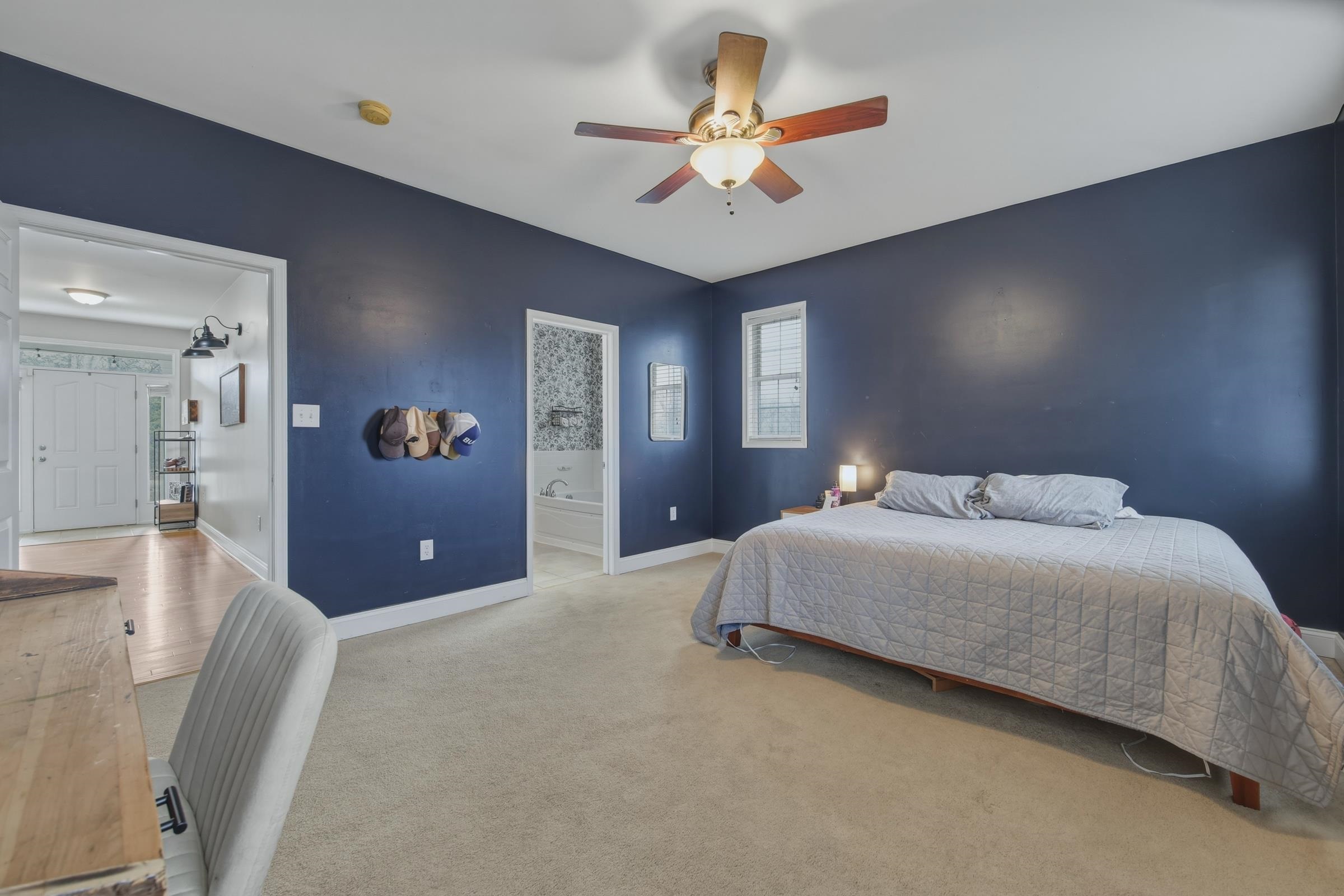 257 Hunter Road Maurertown, VA 22644 - Photo 18 of 61 a spacious bedroom with a bed and a chandelier