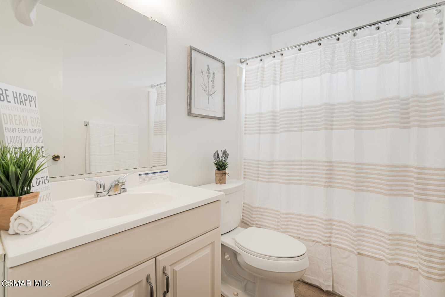1753 Moreno Drive Simi Valley, CA 93063 - Photo 13 of 19 a bathroom with a sink a toilet and shower curtain