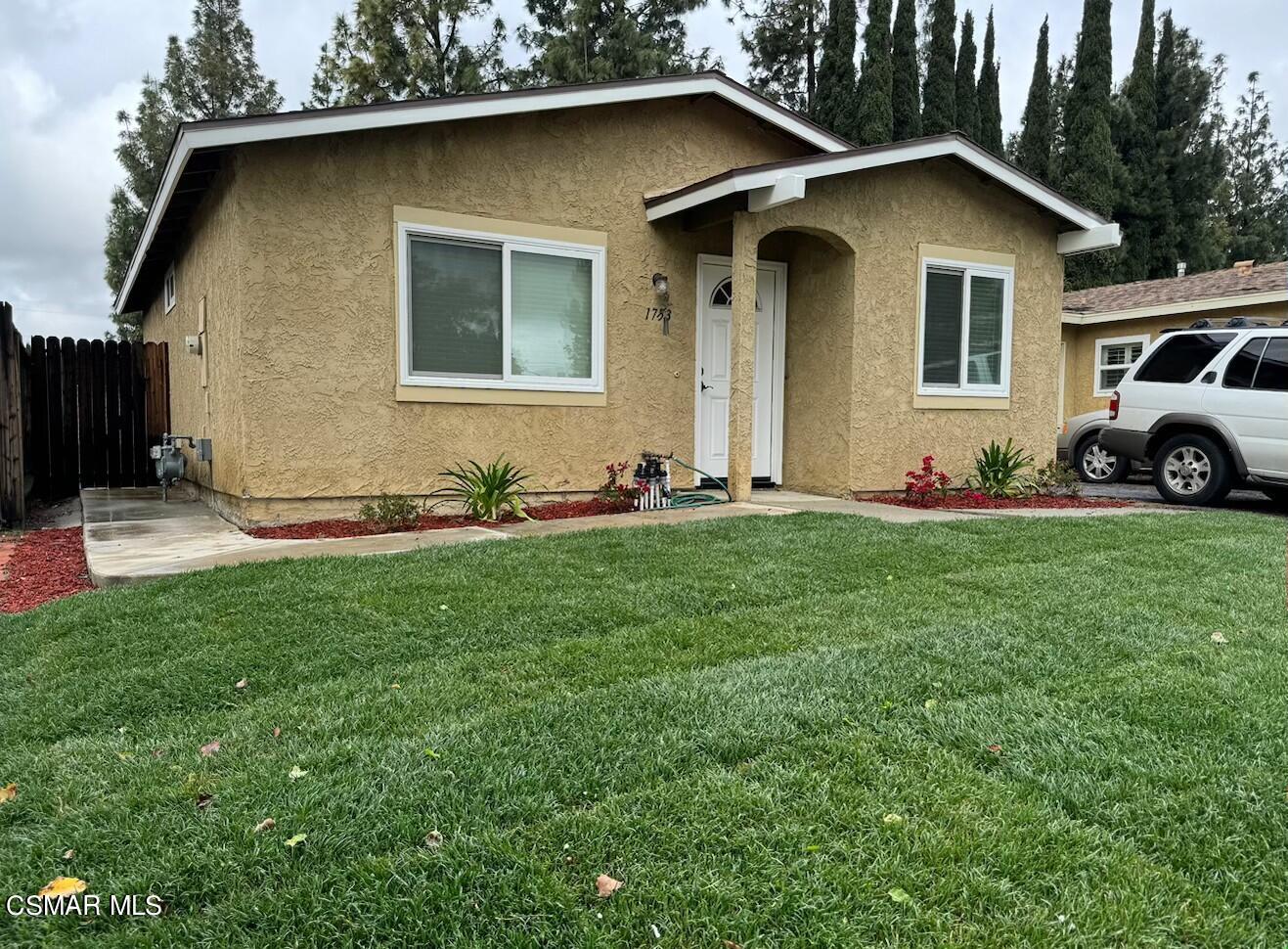 1753 Moreno Drive Simi Valley, CA 93063 - Photo 2 of 19 a front view of a house with a yard