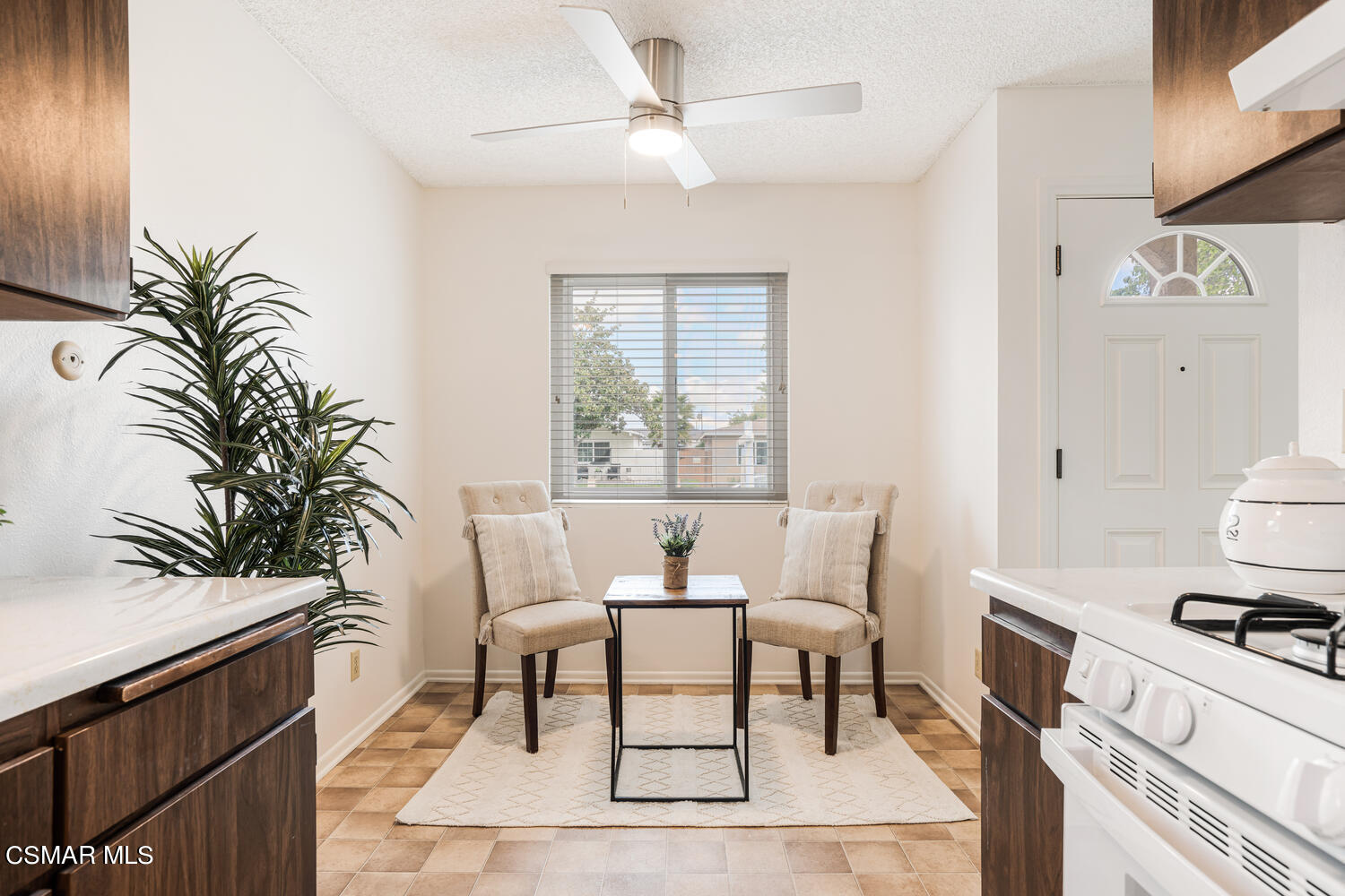1753 Moreno Drive Simi Valley, CA 93063 - Photo 7 of 19 a living room with furniture a table and potted plants on the table
