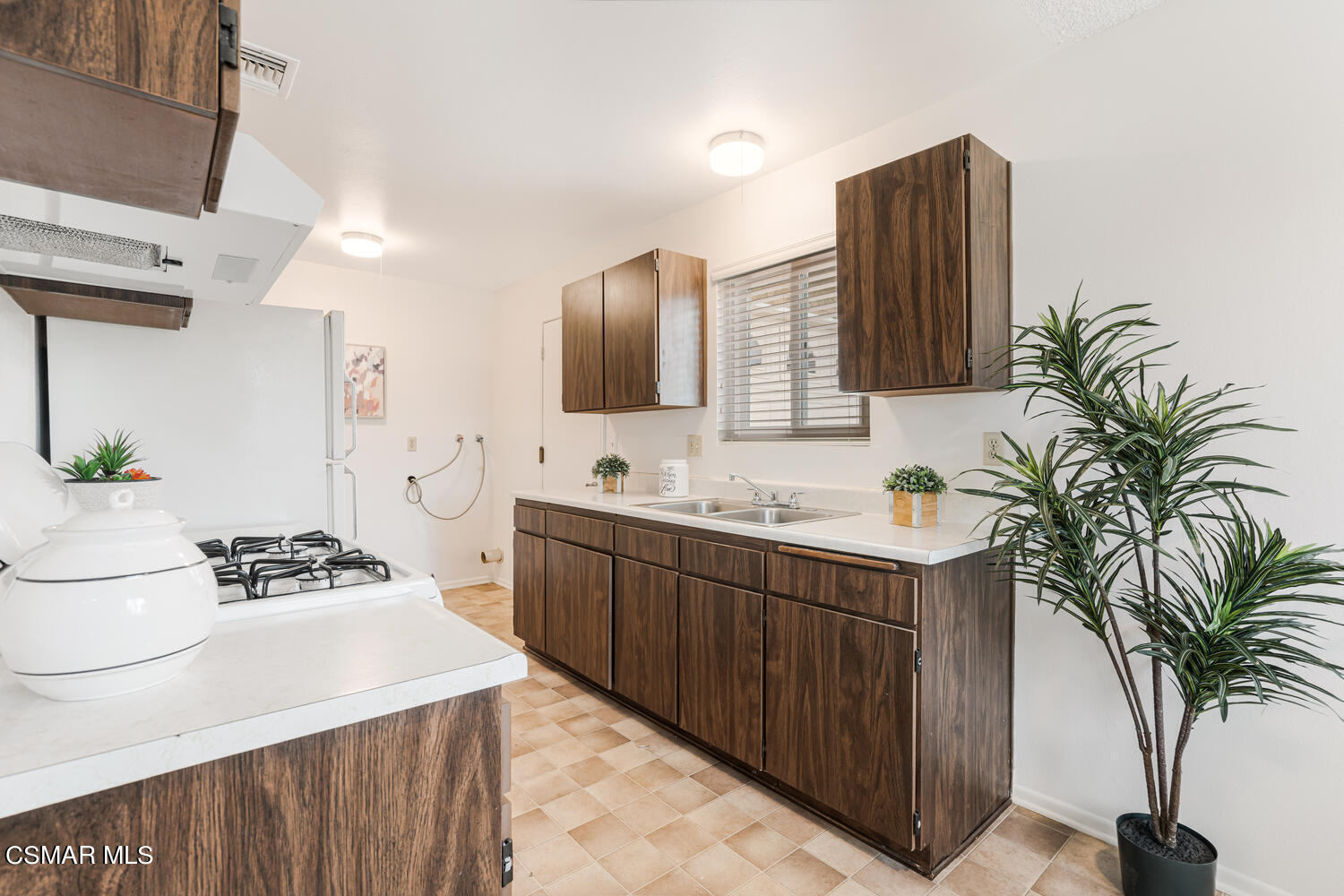 1753 Moreno Drive Simi Valley, CA 93063 - Photo 8 of 19 a kitchen with a sink and stove