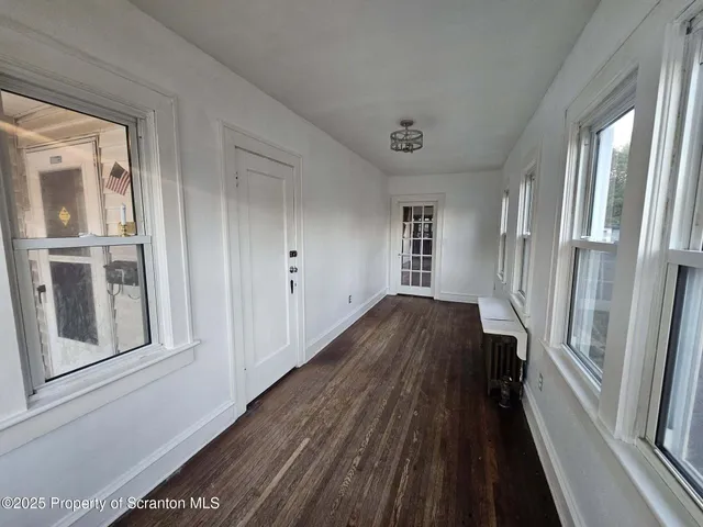 a view of a house with wooden floor and stairs