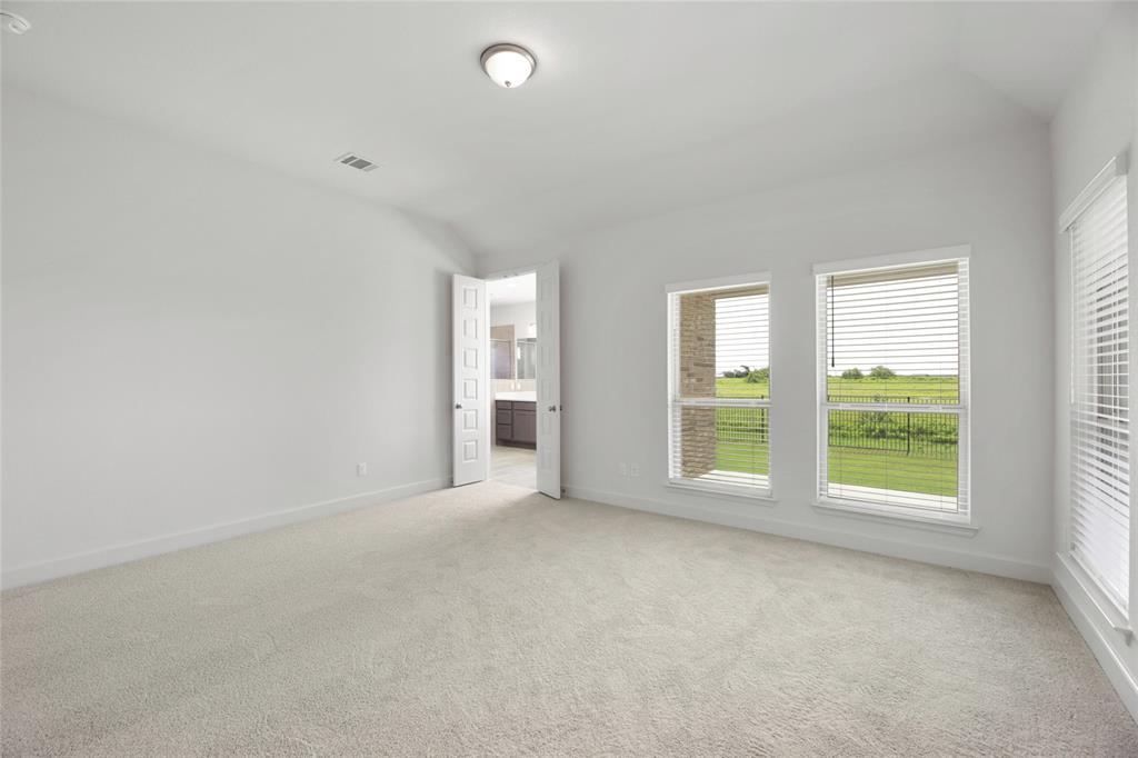 123 Plumbago Loop Bastrop, TX 78602 - Photo 11 of 40 an empty room with windows and closet