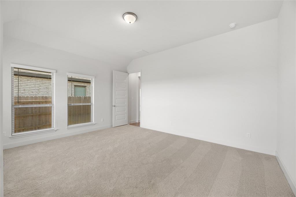 123 Plumbago Loop Bastrop, TX 78602 - Photo 12 of 40 an empty room with windows