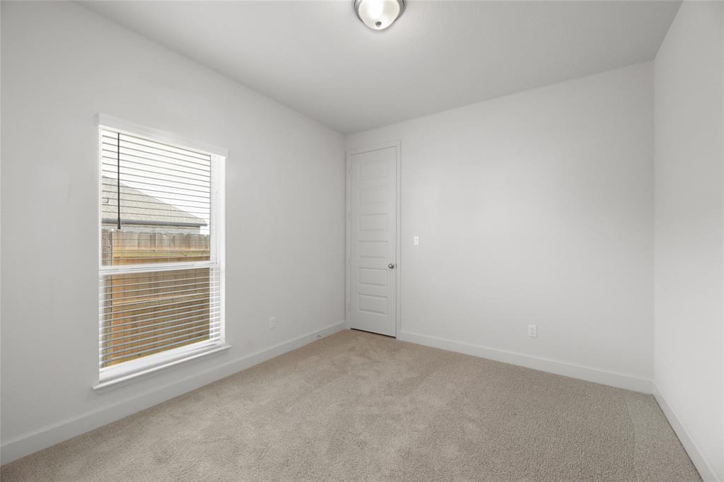 123 Plumbago Loop Bastrop, TX 78602 - Photo 18 of 40 a view of an empty room with a window