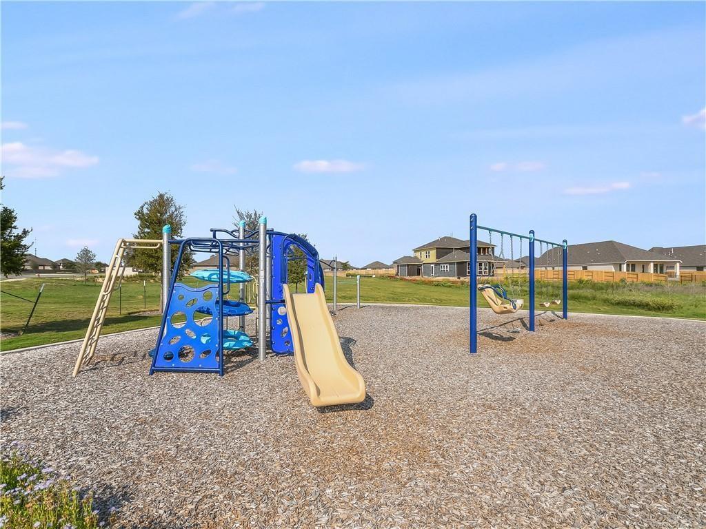 123 Plumbago Loop Bastrop, TX 78602 - Photo 30 of 40 a view of a park with a slide