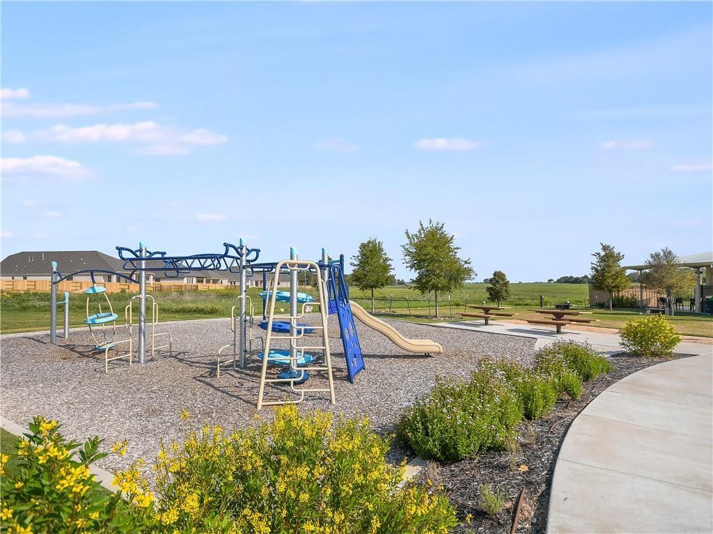 123 Plumbago Loop Bastrop, TX 78602 - Photo 31 of 40 a view of a park with swings and slides