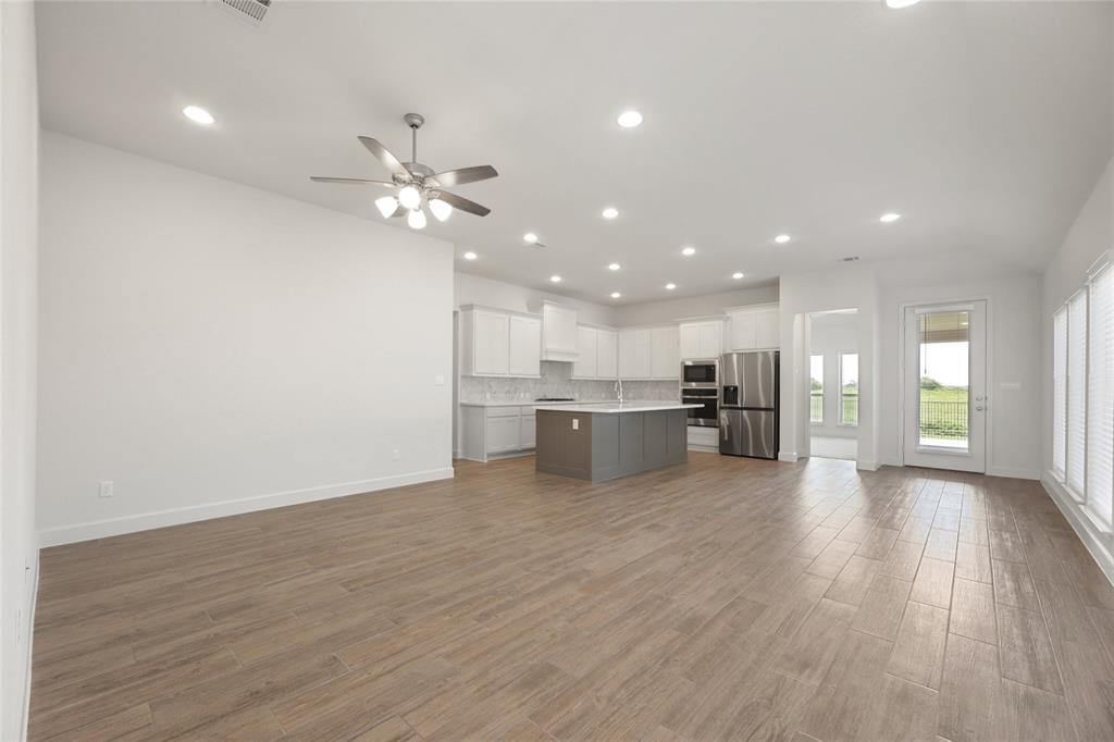 123 Plumbago Loop Bastrop, TX 78602 - Photo 38 of 40 a view of kitchen with stove and wooden floor