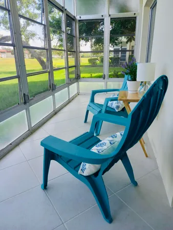 a view of a glass door with a yard from a window
