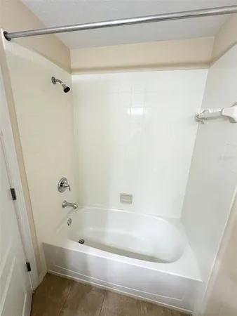 a bathroom with a granite countertop sink a toilet and a mirror