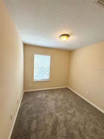 a view of a bathroom with bathtub and shower