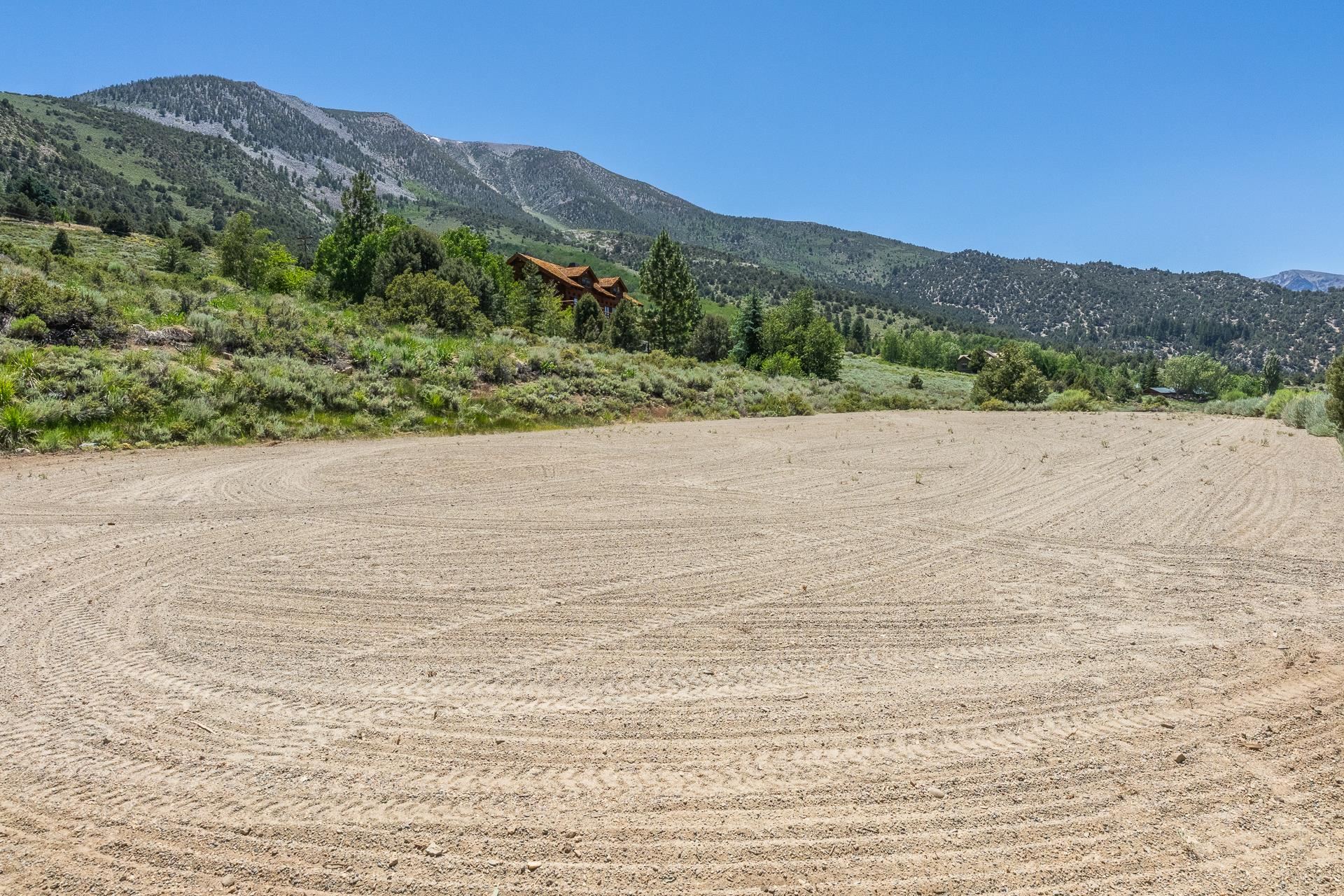537 Aspen Spring Ranch Road Mammoth Lakes, CA 93546 - Photo 33 of 40 Cleared land parcel featuring earth-toned soil and visible tire tracks