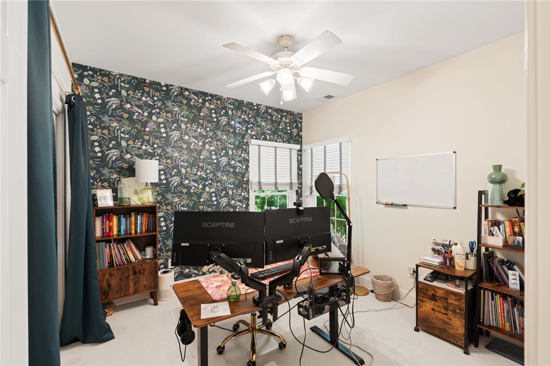 108 Winterbrook Circle Seneca, SC 29678 - Photo 28 of 40 An inviting home office with decorative wallpaper and ample workspace provides a tranquil setting for productivity.