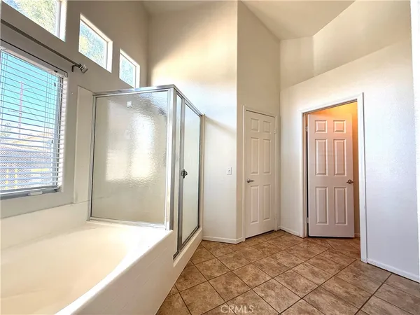 a bathroom with a tub and shower