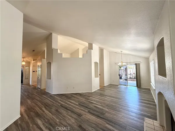 a view of a livingroom with wooden floor