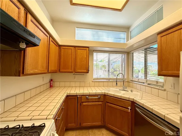 a kitchen with a sink and a window