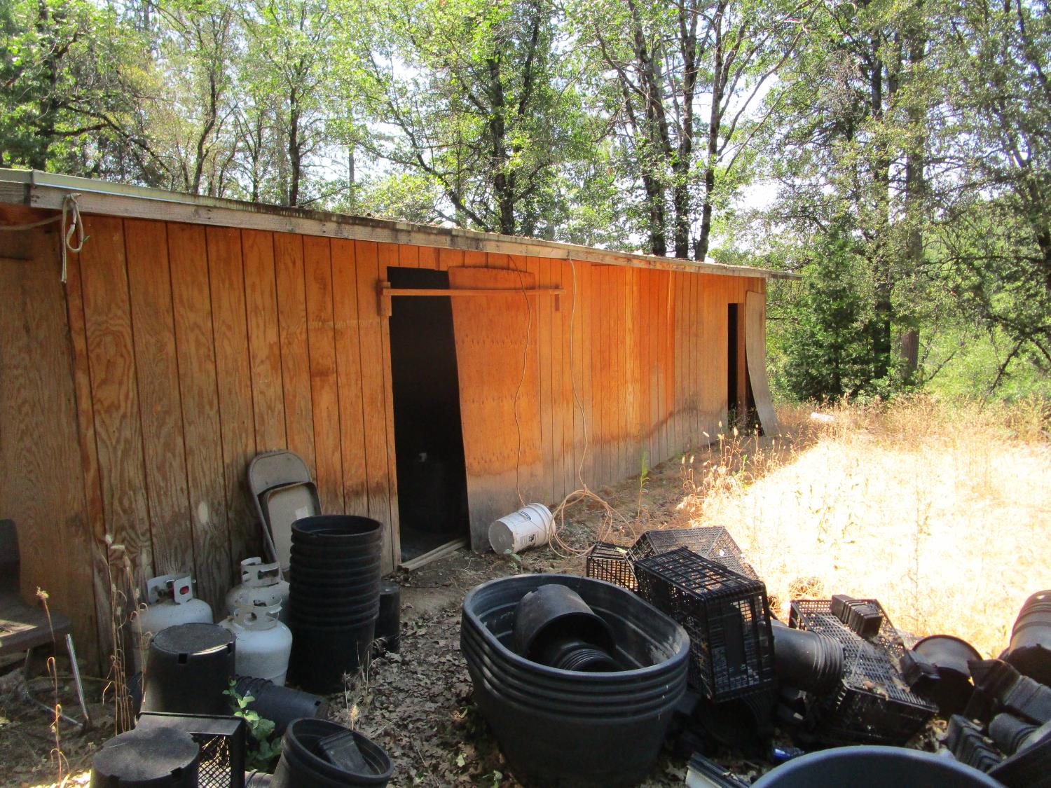 24271 Hoyt Crossing Road Nevada City, CA 95959 - Photo 30 of 66 a backyard of a house with table and chairs