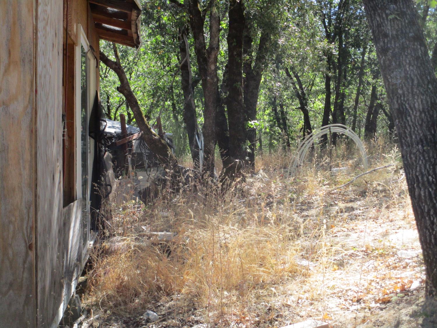 24271 Hoyt Crossing Road Nevada City, CA 95959 - Photo 60 of 66 a backyard of a house with table and chairs