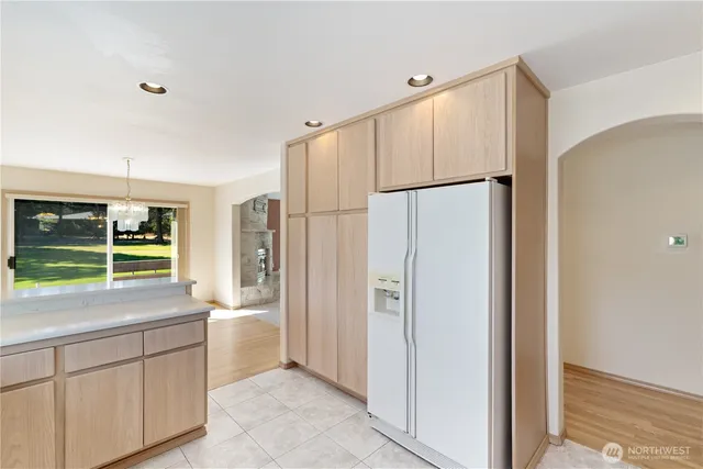 a kitchen with stainless steel appliances a refrigerator and a sink