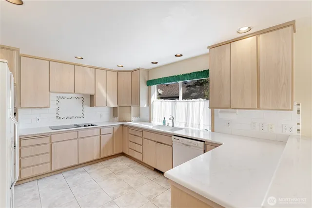 a kitchen with a sink and cabinets