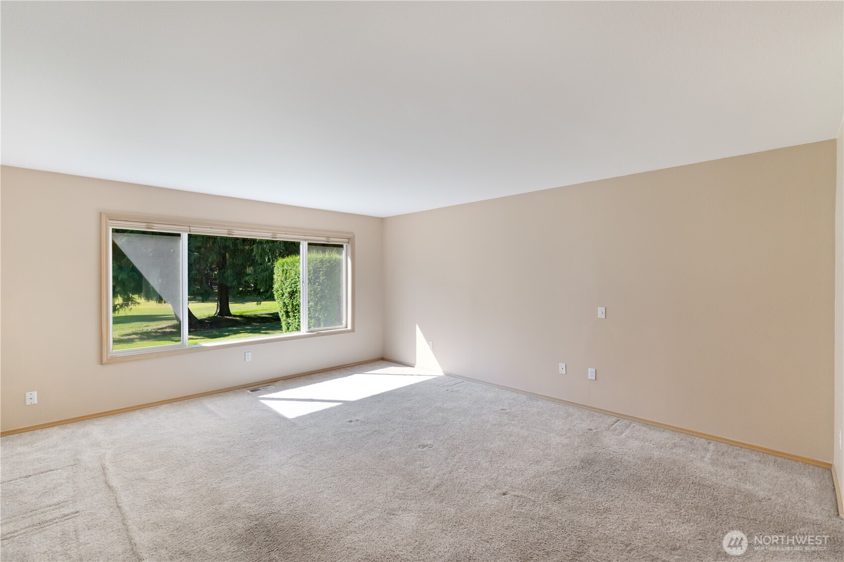 292 Foursome Drive Sequim, WA 98382 - Photo 17 of 32 a view of an empty room with a window