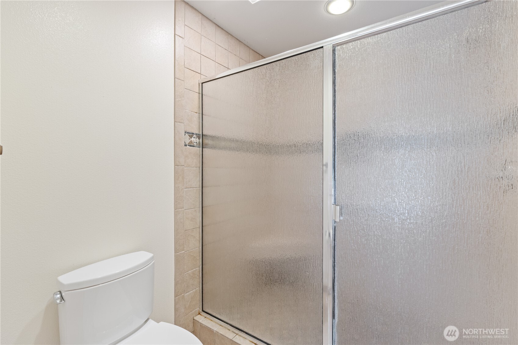 292 Foursome Drive Sequim, WA 98382 - Photo 25 of 32 a bathroom with a shower and toilet