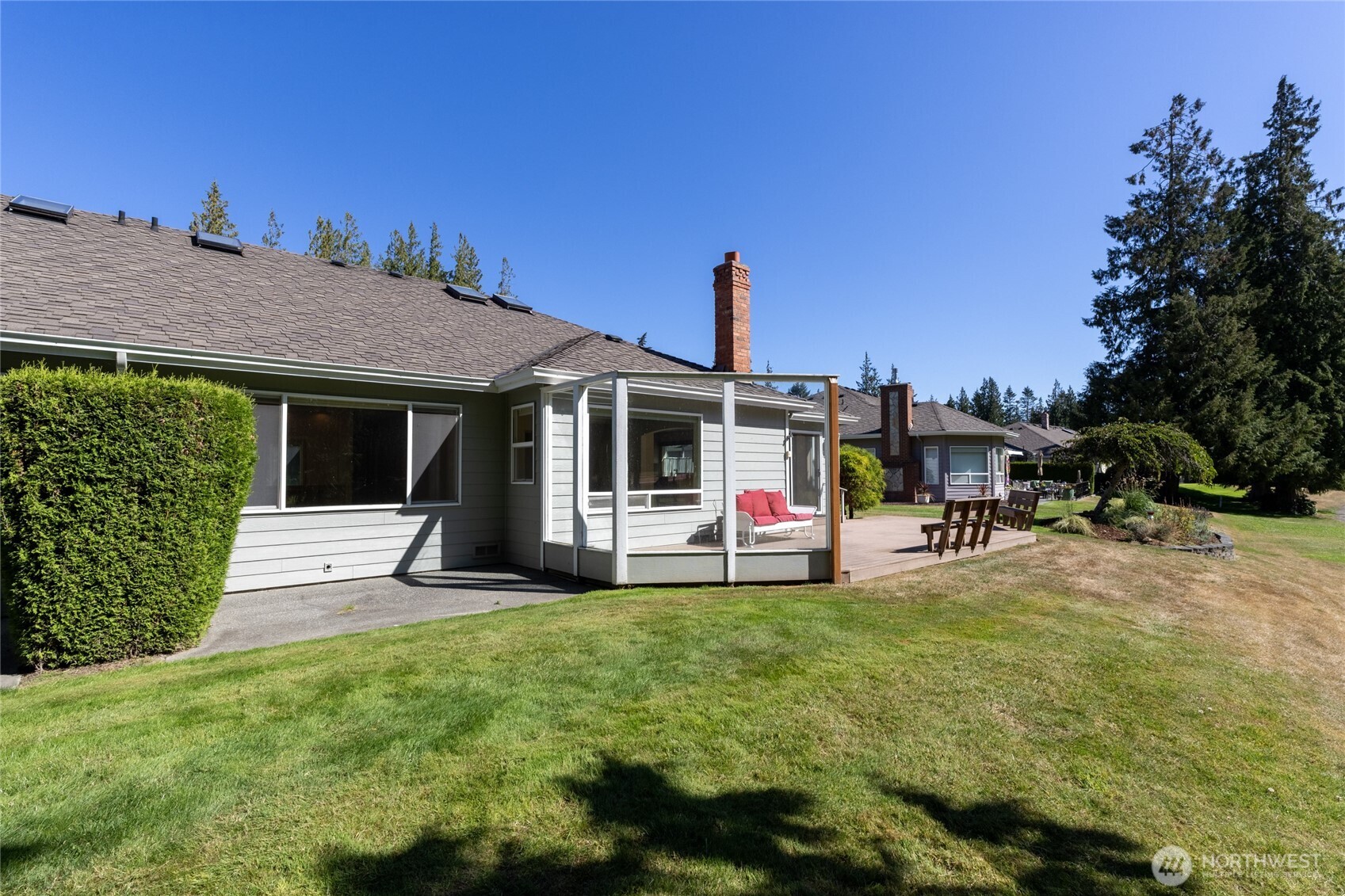 292 Foursome Drive Sequim, WA 98382 - Photo 29 of 32 a view of a house with backyard sitting area and garden