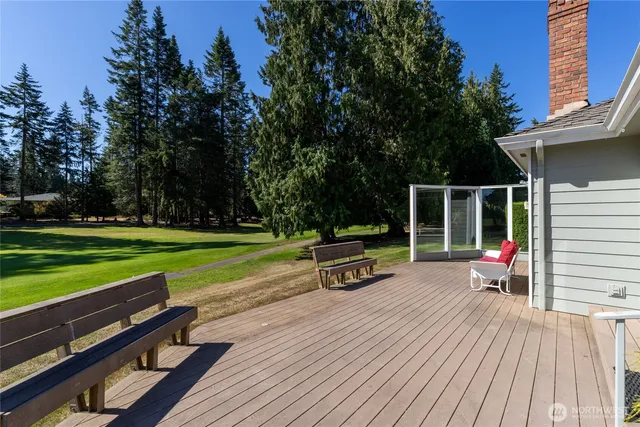 a view of outdoor sitting area with furniture and garden