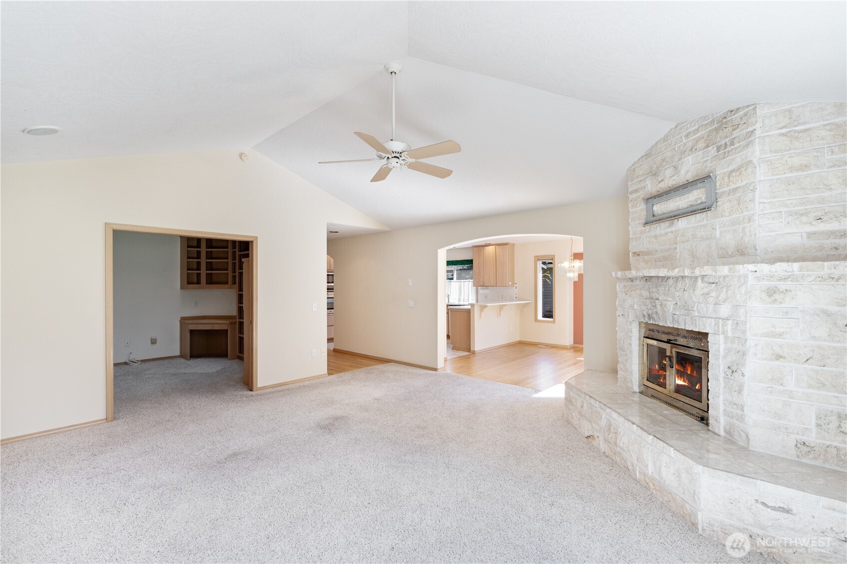 292 Foursome Drive Sequim, WA 98382 - Photo 8 of 32 an empty room with windows and fireplace