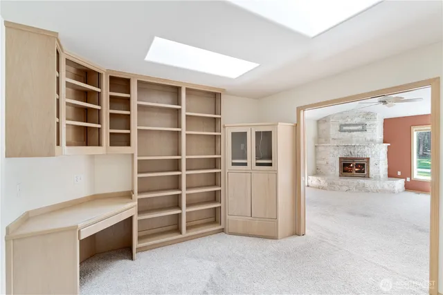 a view of an empty room with empty shelves