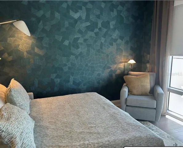 a dining room with a large window and table