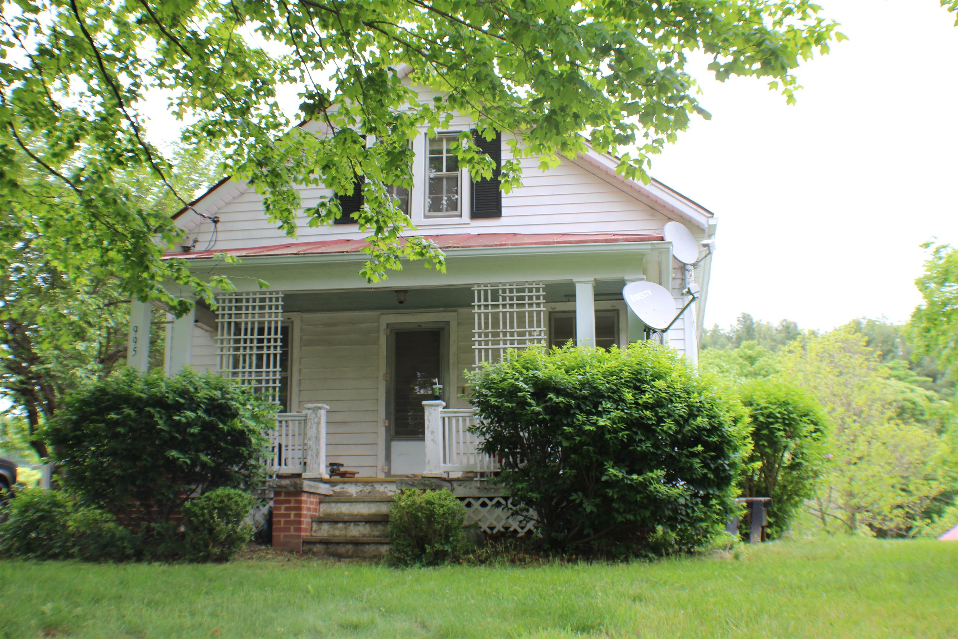 995 McKinley Road Middlebrook, VA 24459 - Photo 1 of 32 a front view of a house with a garden