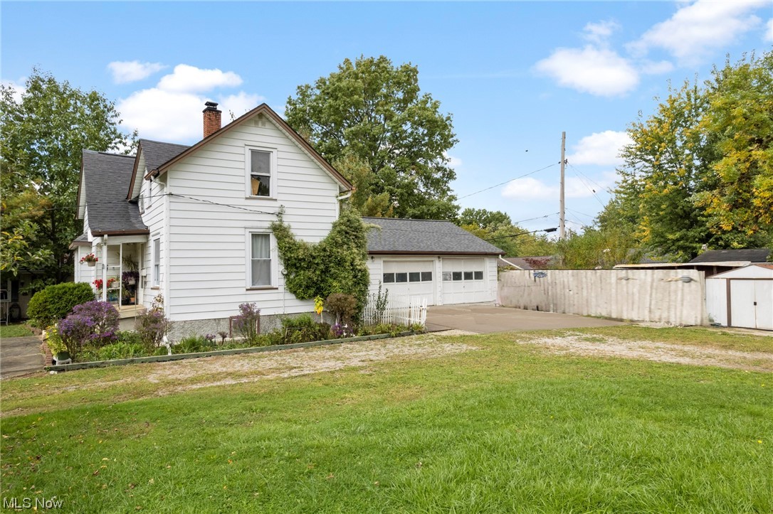 424 Sprague Road Berea, OH 44017 - Photo 22 of 24 Rear view of house with a shed and a yard