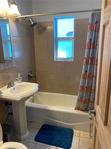 a bathroom with a sink and a bathtub