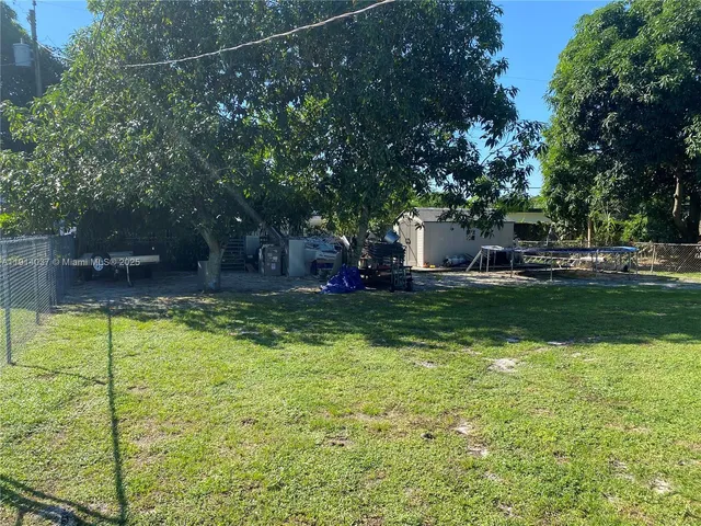 a view of swimming pool with trees