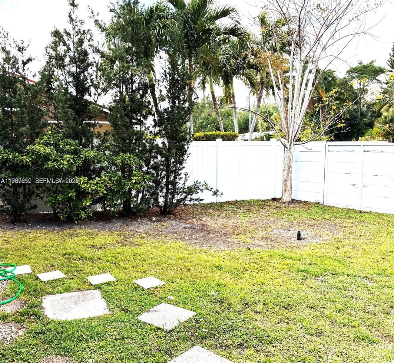 4541 Southwest 28th Terrace Dania Beach, FL 33312 - Photo 6 of 9 a view of a swimming pool with an outdoor space