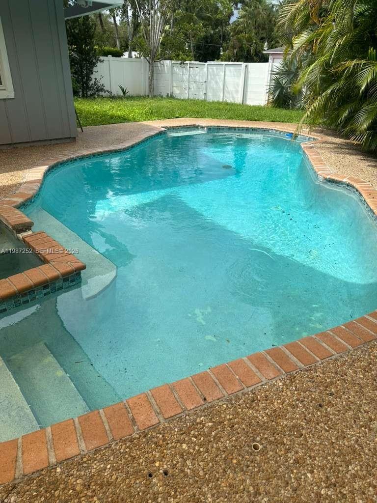 4541 Southwest 28th Terrace Dania Beach, FL 33312 - Photo 9 of 9 a view of an outdoor space and swimming pool