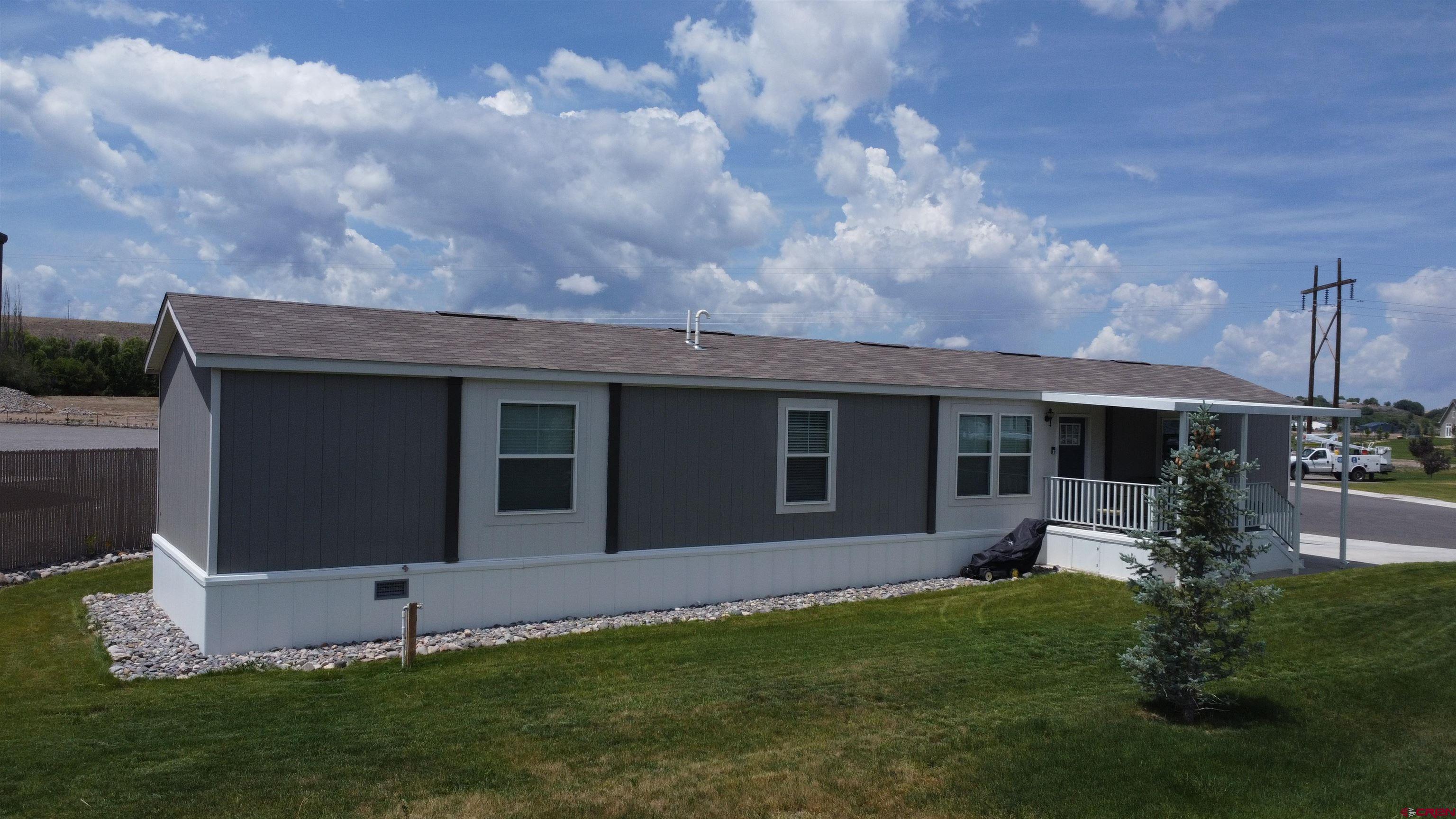 a view of a house with backyard and garden