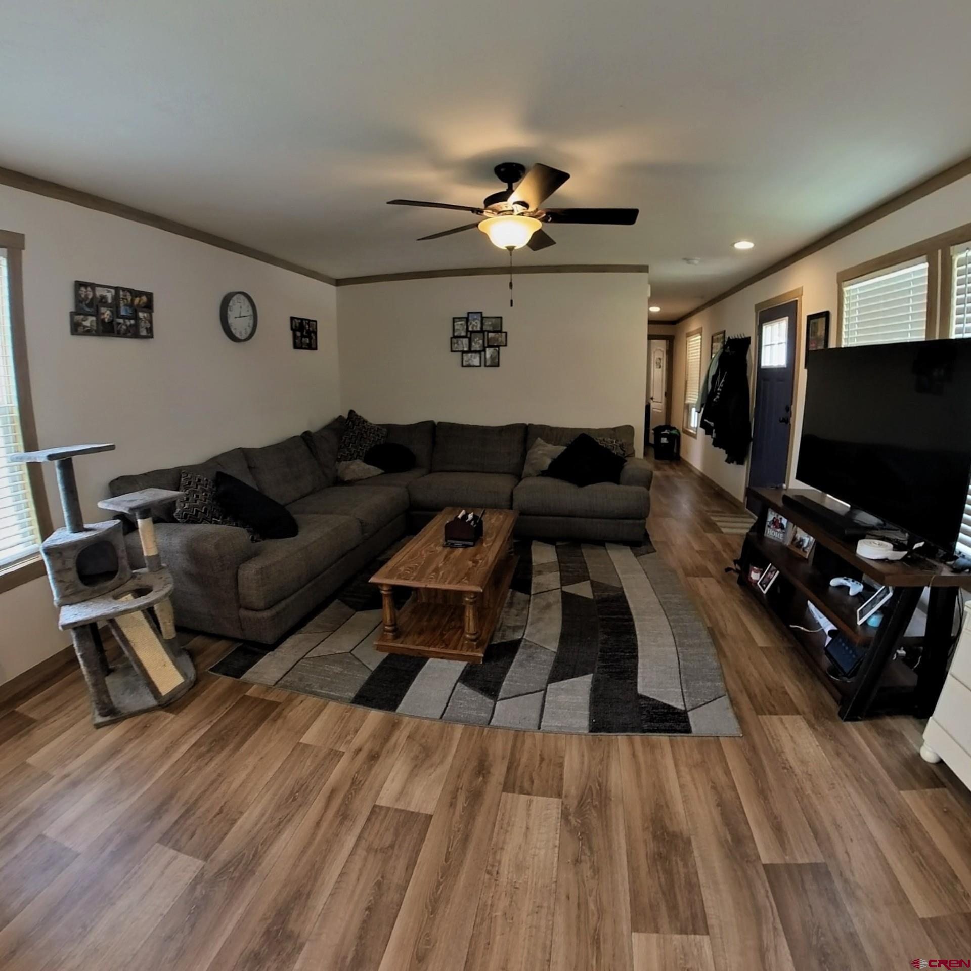 62650 Lasalle Road, Unit 822 Montrose, CO 81403 - Photo 7 of 17 a living room with furniture and a flat screen tv