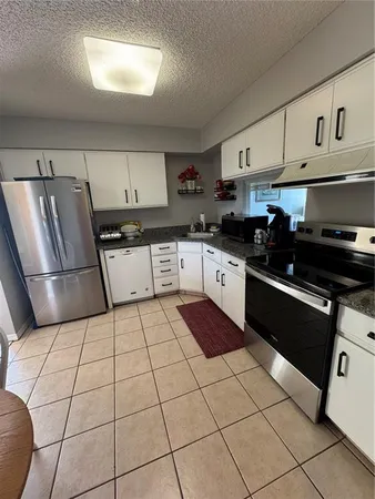 a view of a hallway with washer and dryer