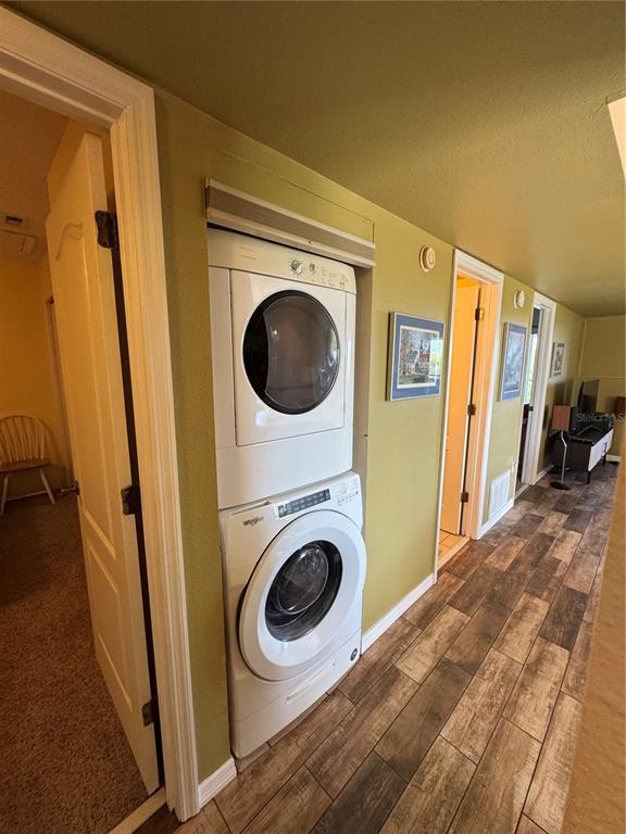 5567 Sea Forest Drive, Unit 319 New Port Richey, FL 34652 - Photo 15 of 34 a view of a hallway with washer and dryer