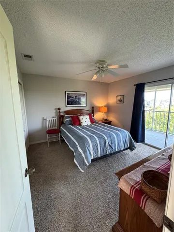 a bedroom with a bed and a television in it