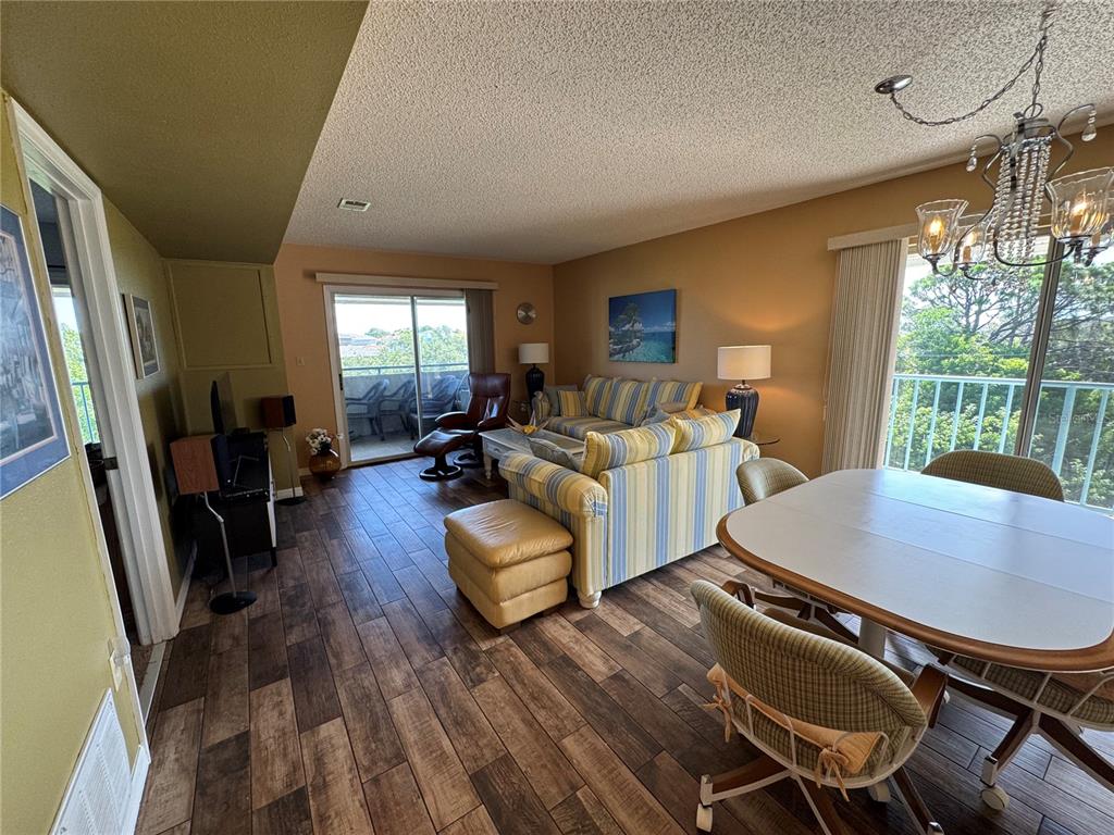 5567 Sea Forest Drive, Unit 319 New Port Richey, FL 34652 - Photo 21 of 34 a living room with furniture rug and wooden floor