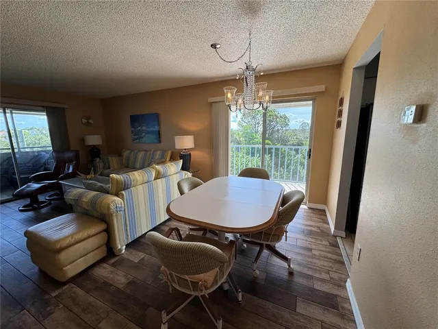 a view of a balcony with a yard