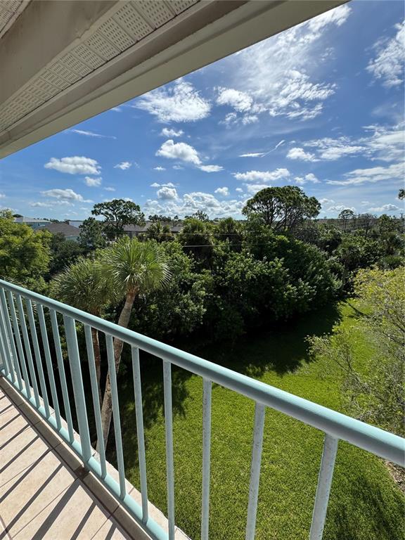 5567 Sea Forest Drive, Unit 319 New Port Richey, FL 34652 - Photo 23 of 34 a view of a balcony with a yard