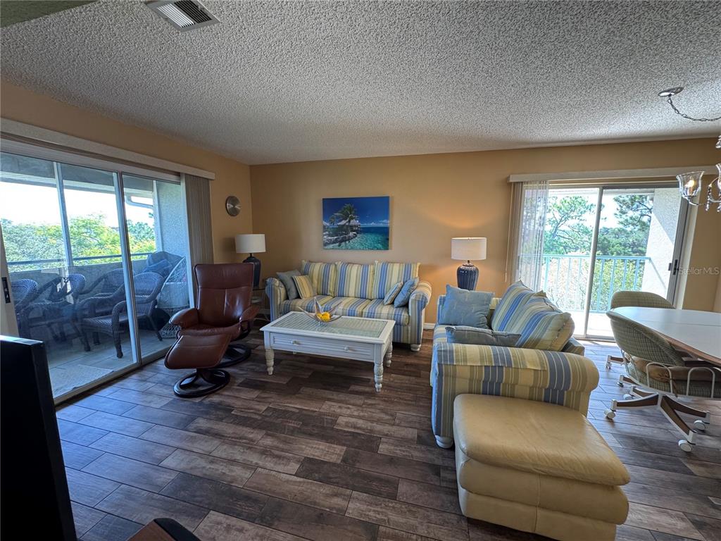 5567 Sea Forest Drive, Unit 319 New Port Richey, FL 34652 - Photo 25 of 34 a living room with furniture and a large window