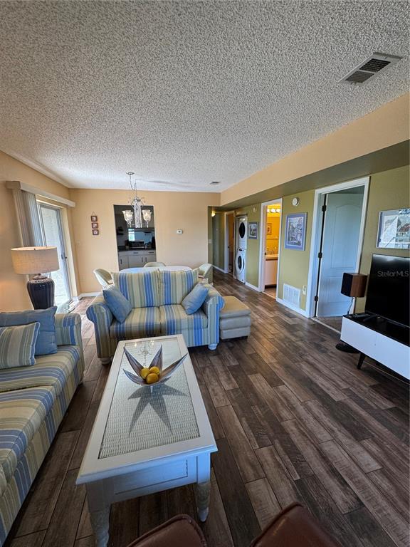 5567 Sea Forest Drive, Unit 319 New Port Richey, FL 34652 - Photo 27 of 34 a living room with furniture and a wooden floor
