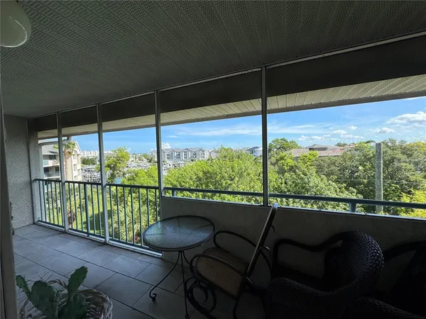 a view of a balcony with chair