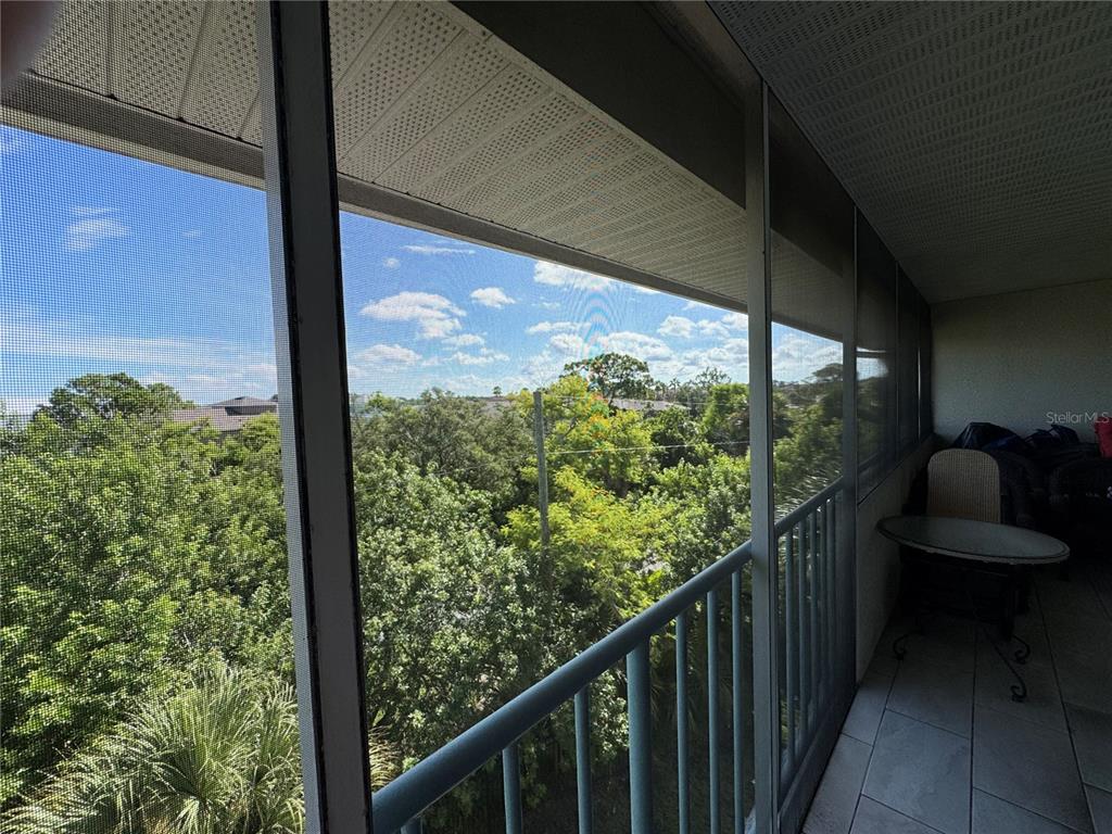 5567 Sea Forest Drive, Unit 319 New Port Richey, FL 34652 - Photo 30 of 34 a view of a balcony with chair